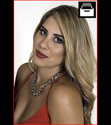 Model, blond hair wearing red dresss