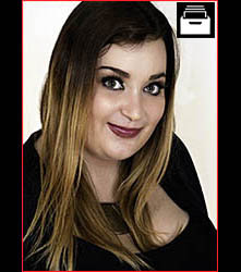 Model wearing black dress, long hair