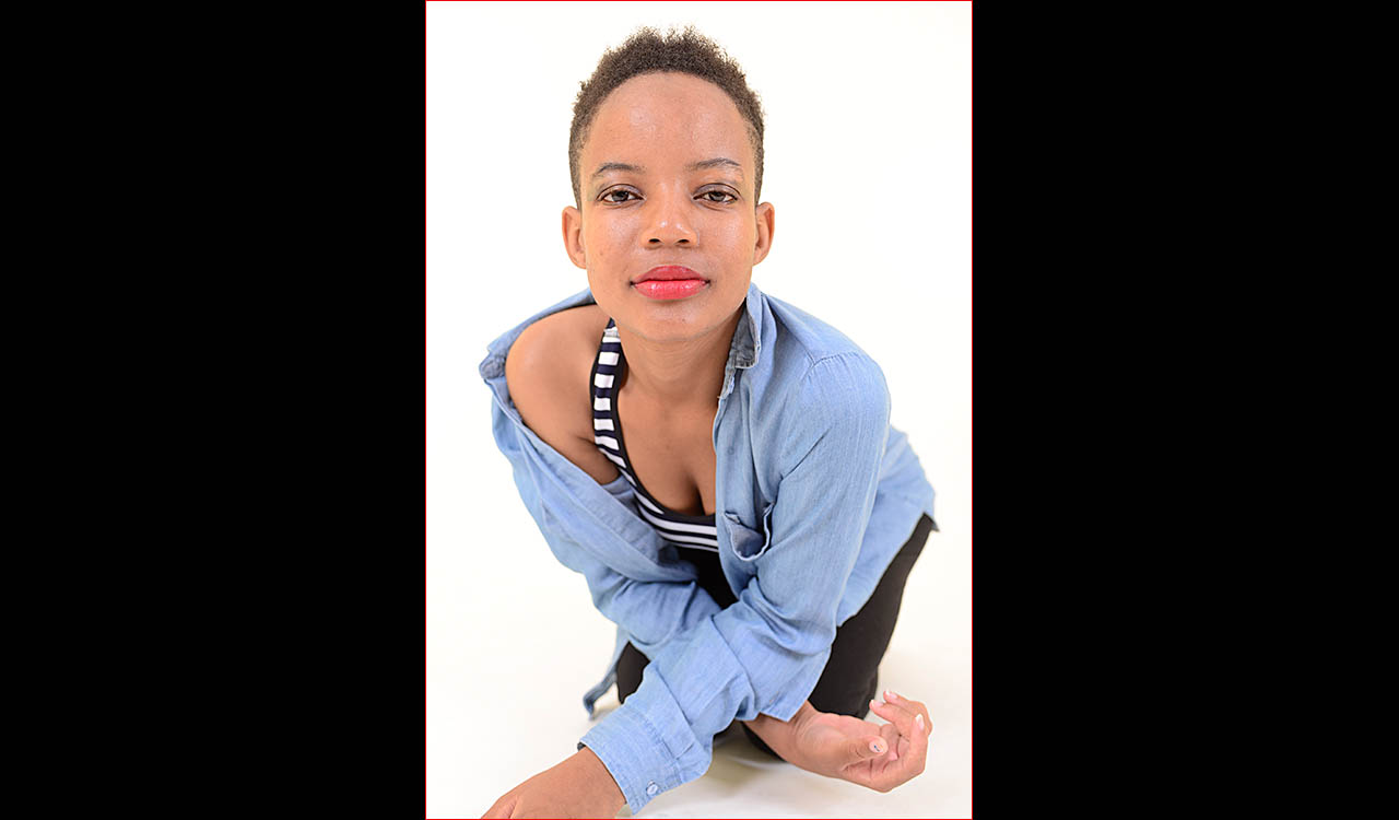 Attractive model wearing blue top and black jeans
