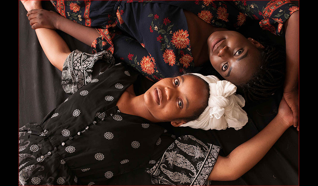Simbi and Jenifer models laying down together
